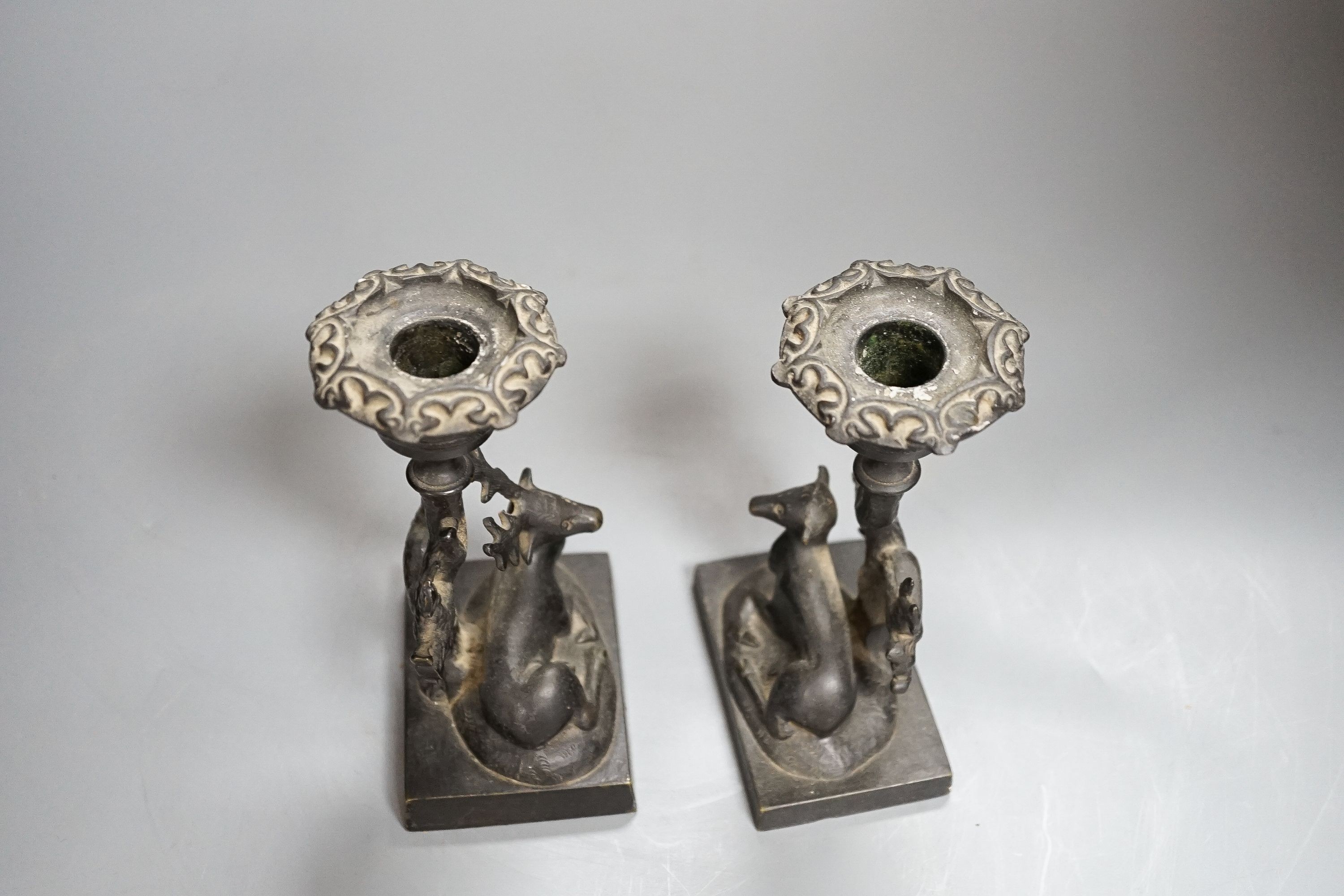 A pair of 19th century bronze ‘stag and doe’ dwarf candlesticks 14cm